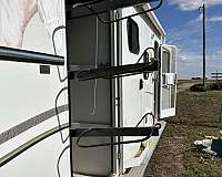 beige-trailer-with-a-fifth-wheel-hitch